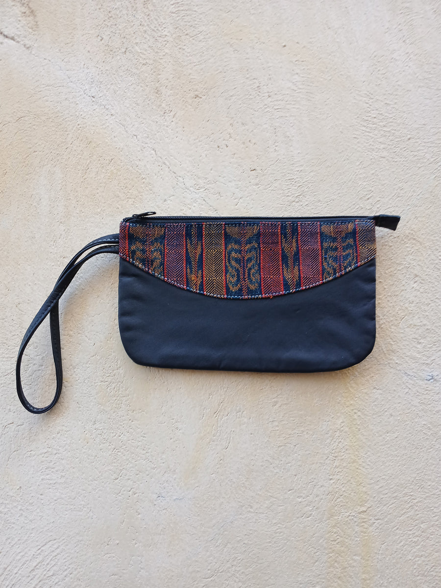 Upcycled leather clutch with colorful Mayan fabrics