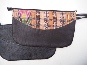 Upcycled leather clutch with colorful Mayan fabrics